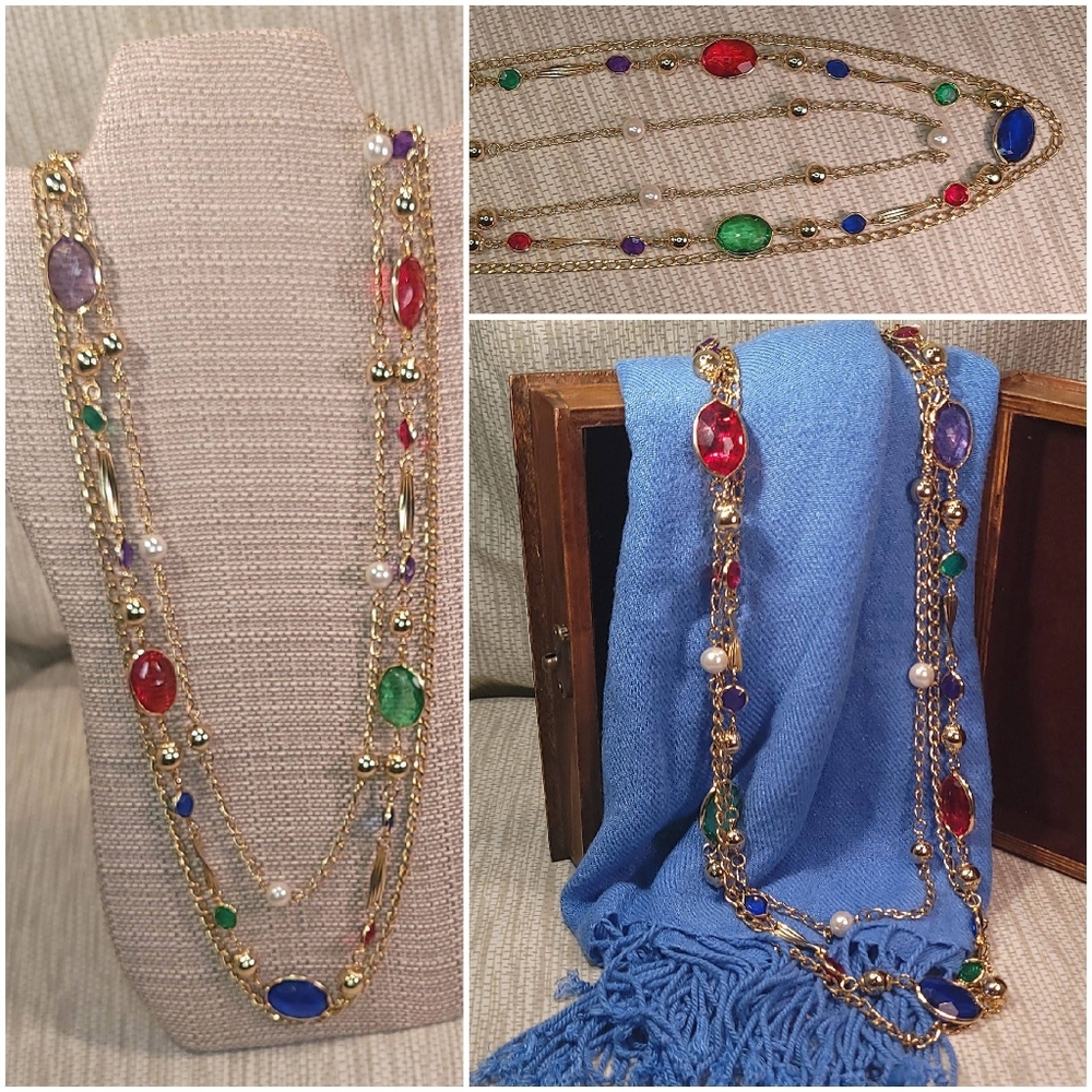Long gold chain with various colored stones spaced apart.
